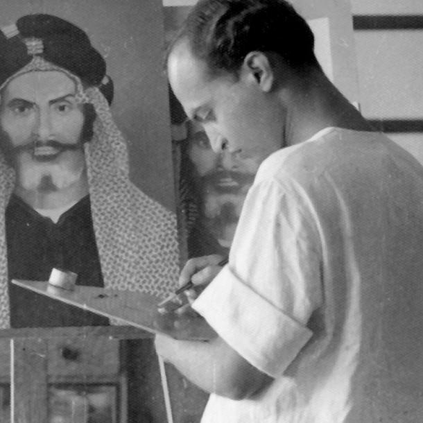 photo Babuji Rajendra Shilpi working on a painting in his studio in India