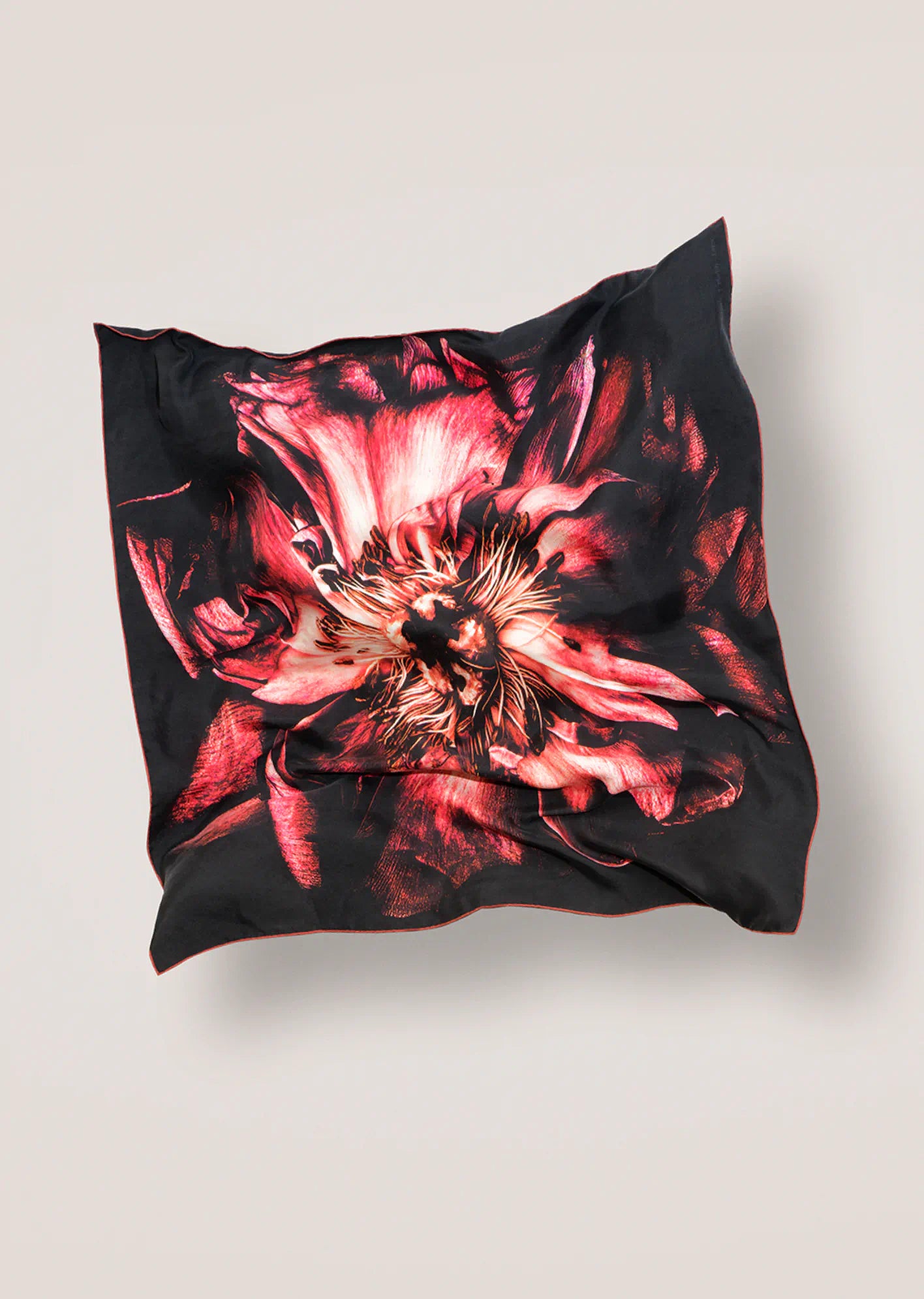 Floral patterned scarf by James T Murray on a light gray background
