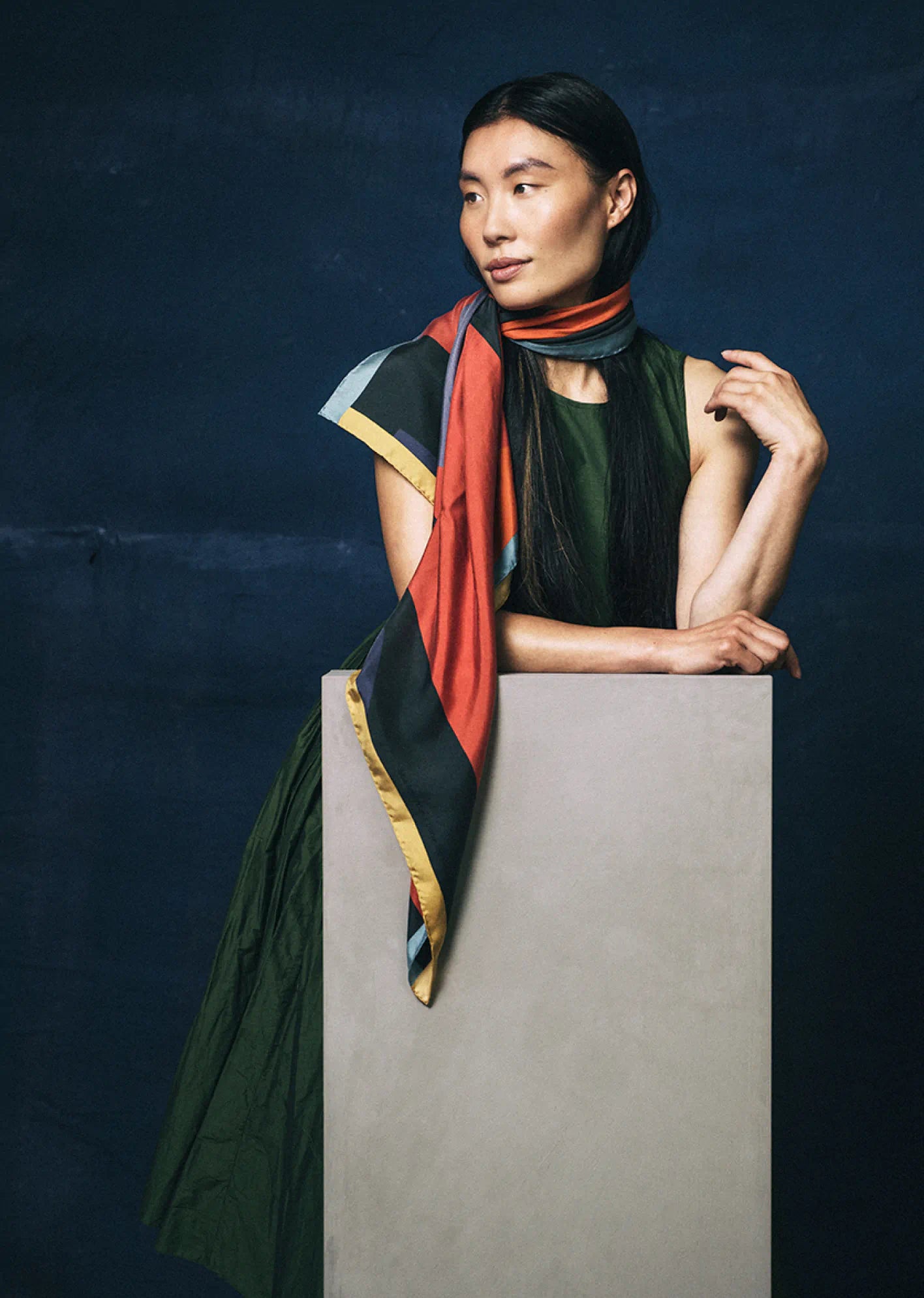 Colorful square scarf by Darshana Shilpi Rouget with abstract patterns on a beige background 