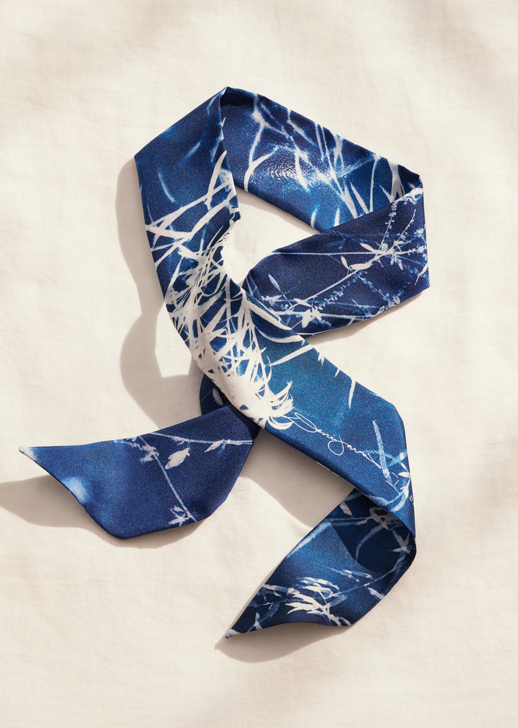 limited edition of 80, 5cm x 86cm, Made in Italy, 100% silk twilly scarf made in Artist Deni Javas’s signature cyanotype style