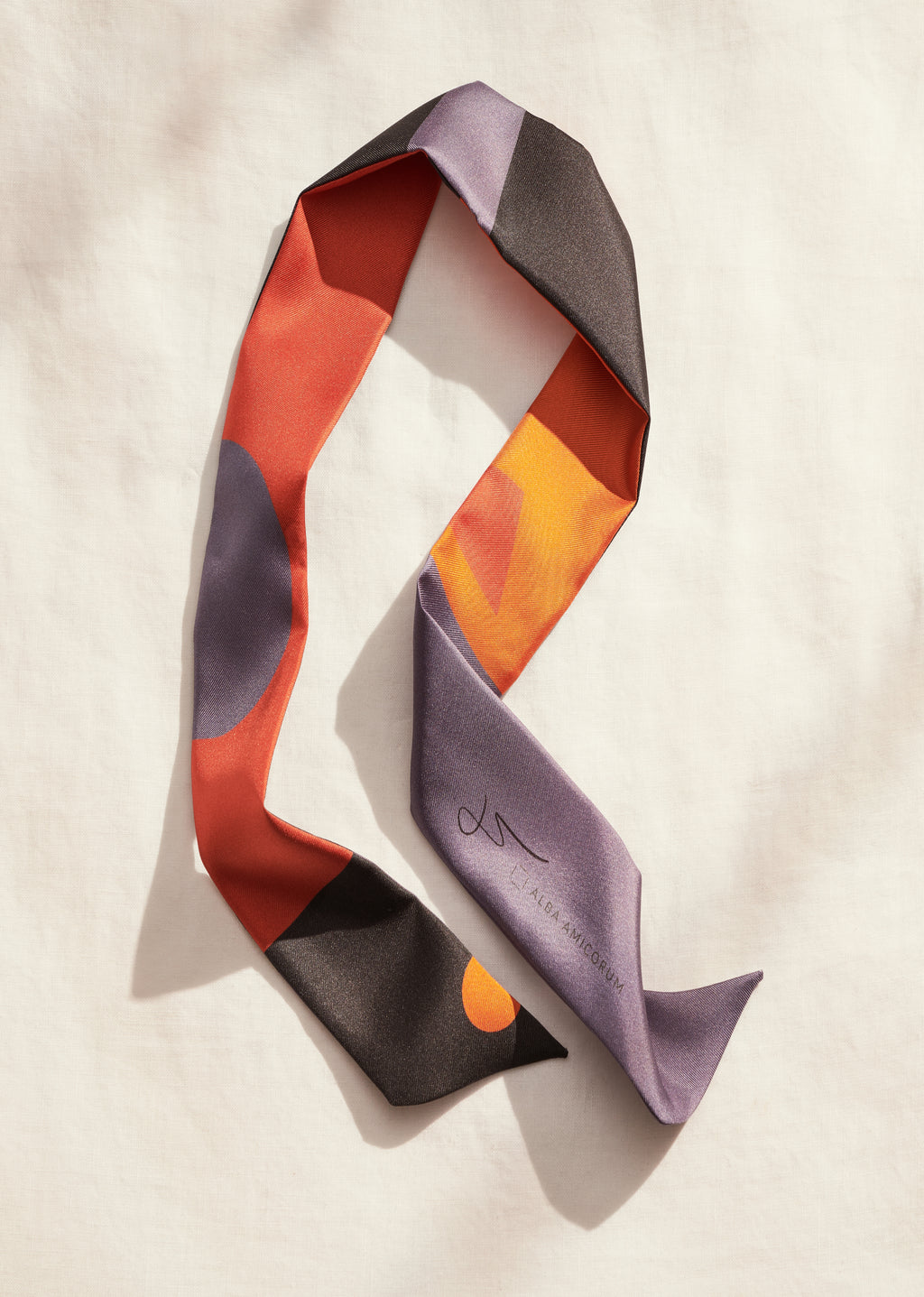 Artist and designer Darshana Shilpi Rouget’s silk twilly reveals constantly changing shapes in surprising jewel-hued combinations. 